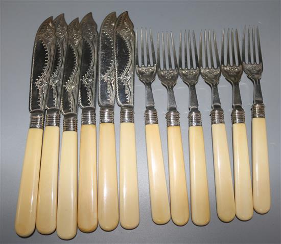 Six pairs of late Victorian ivory handled silver fish eaters,